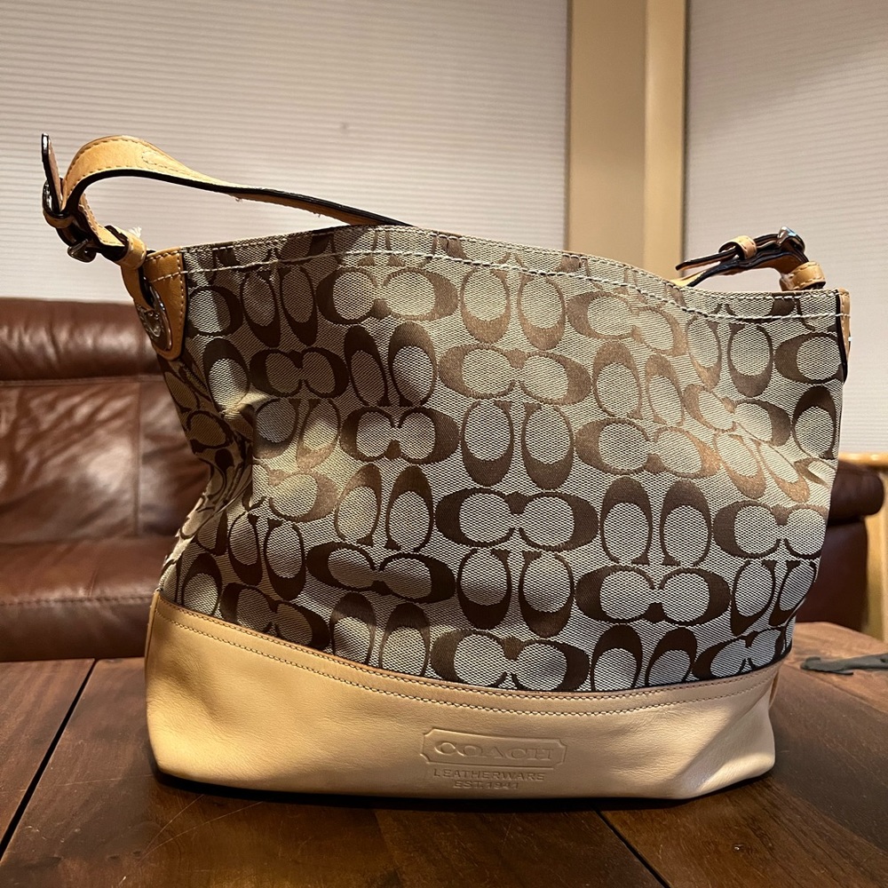 Coach tote. Light tan leather bottom.